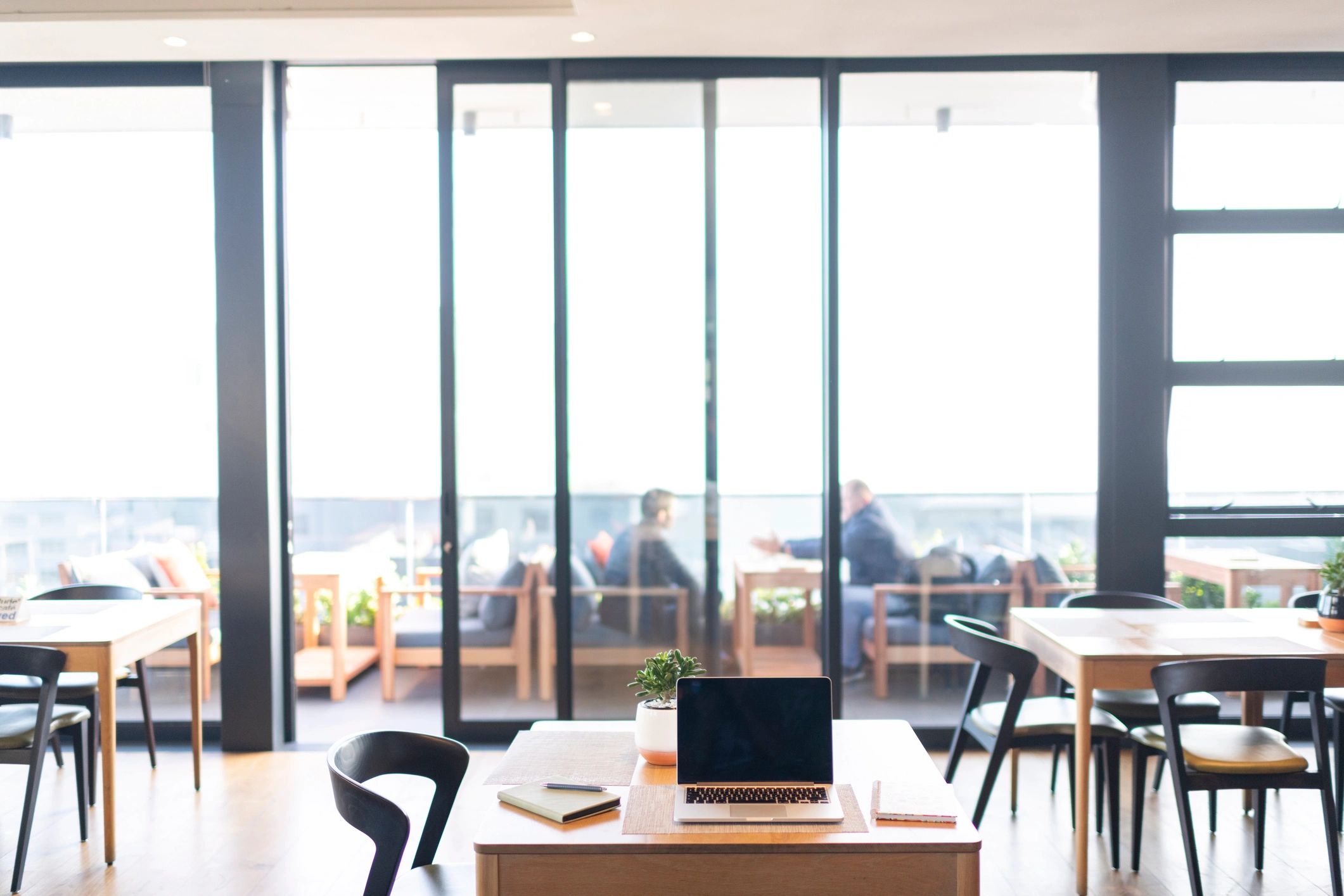 Modern finance workspace with laptop and notebook