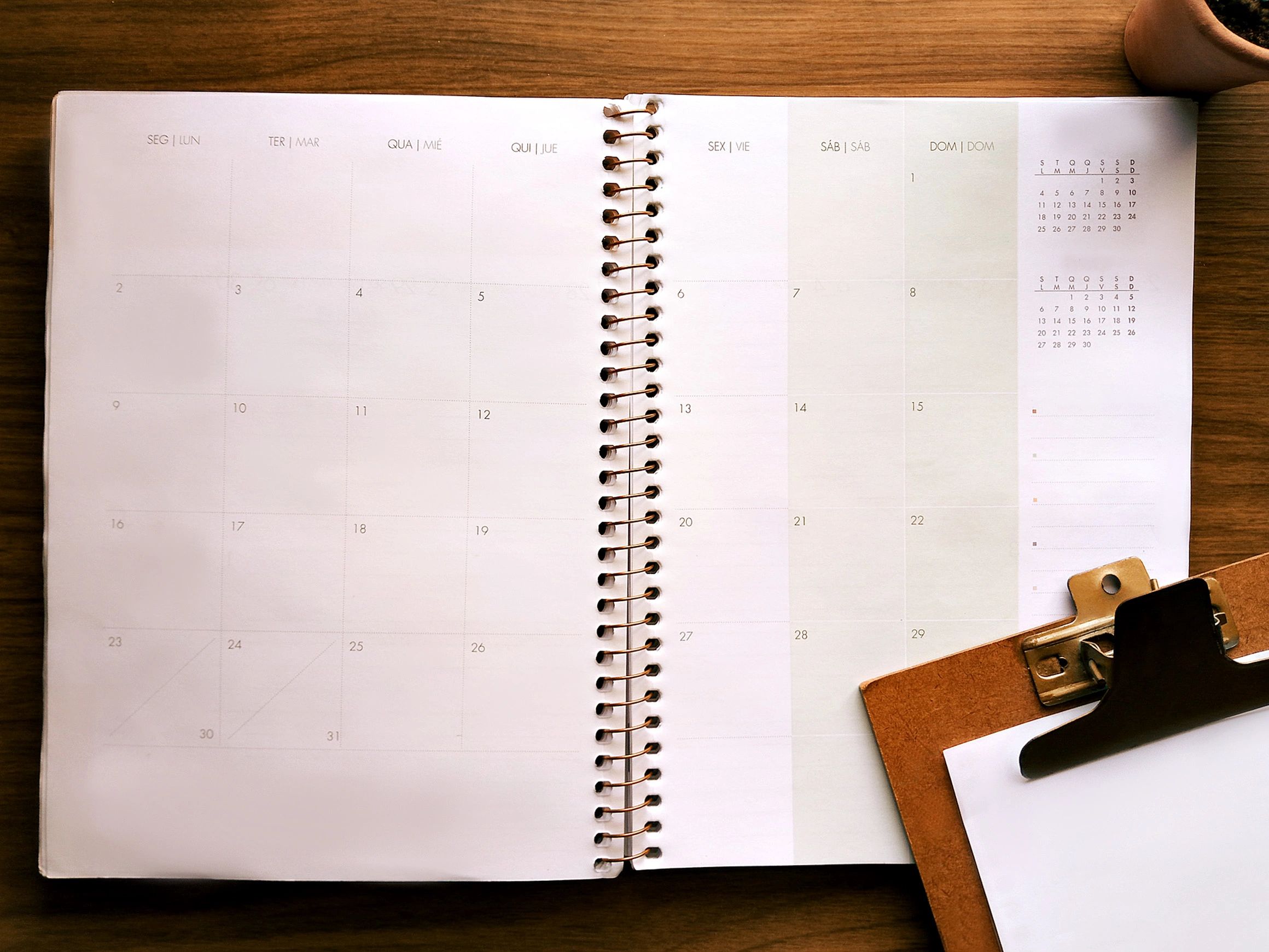 Planner desk representing long-term wealth-building progress