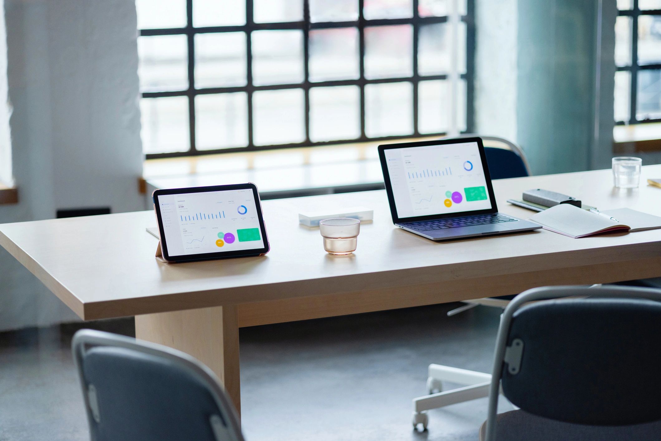 Modern Business Workspace With Laptop and Tablet on Table